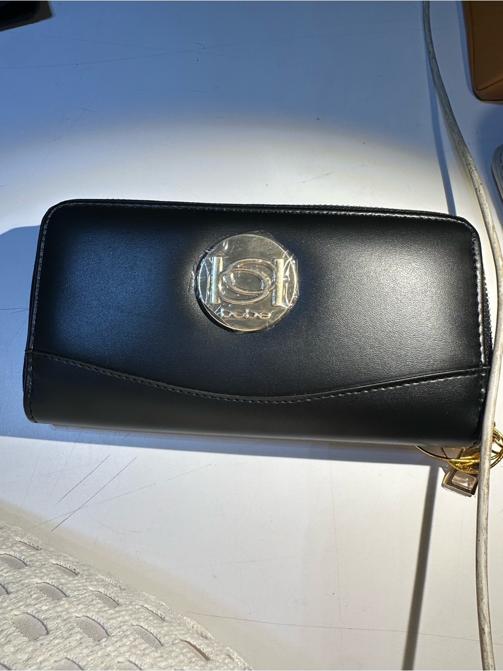 bebe Black Zip-Around Wallet with gold Logo Medallion